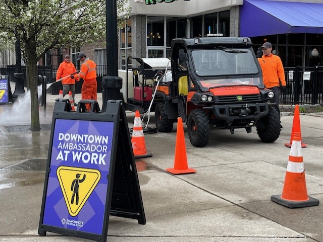 Ambassadors pressure wash sidewalks in Downtown Wilkes-Barre.